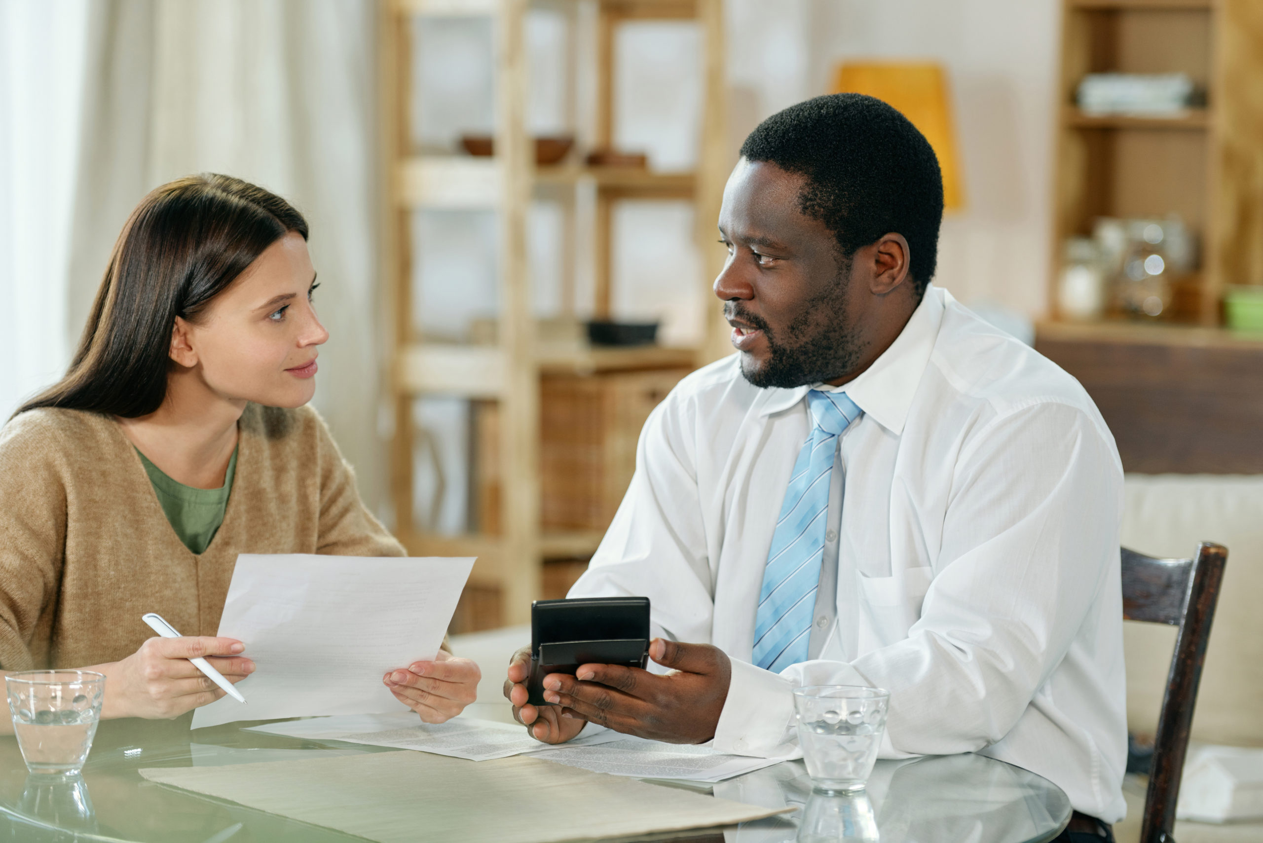 Diverse man and woman consulting on loan